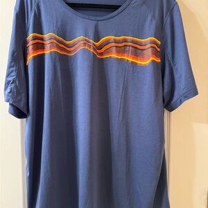 NWOT Janji Run All Day Men's Navy Short Sleeve Shirt With Vibrant Stripe Design